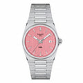 Tissot PRX watch with a brushed silver stainless steel bracelet and case, featuring a textured pink dial with silver indices and hands.